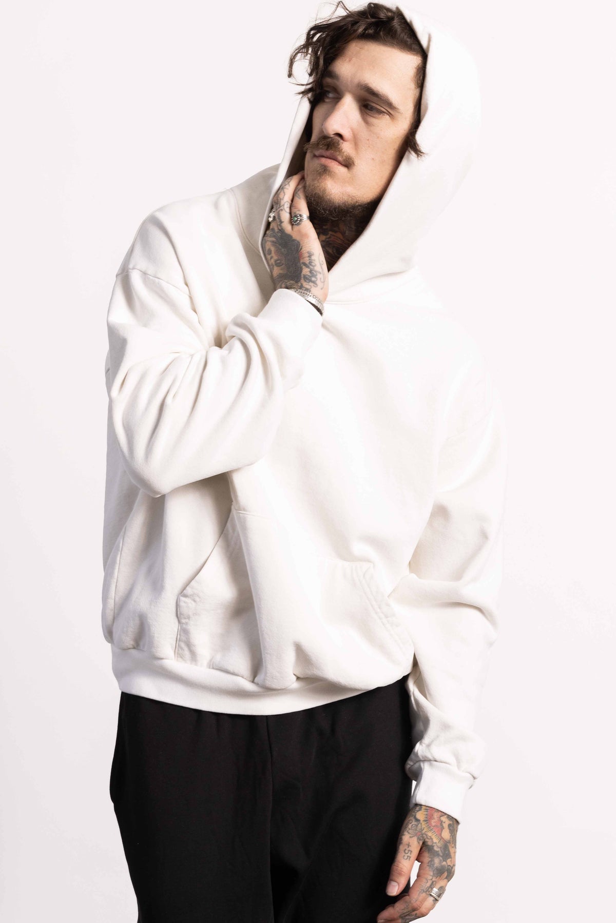 White male model with edgy style wearing a heavyweight cotton off white hoodie