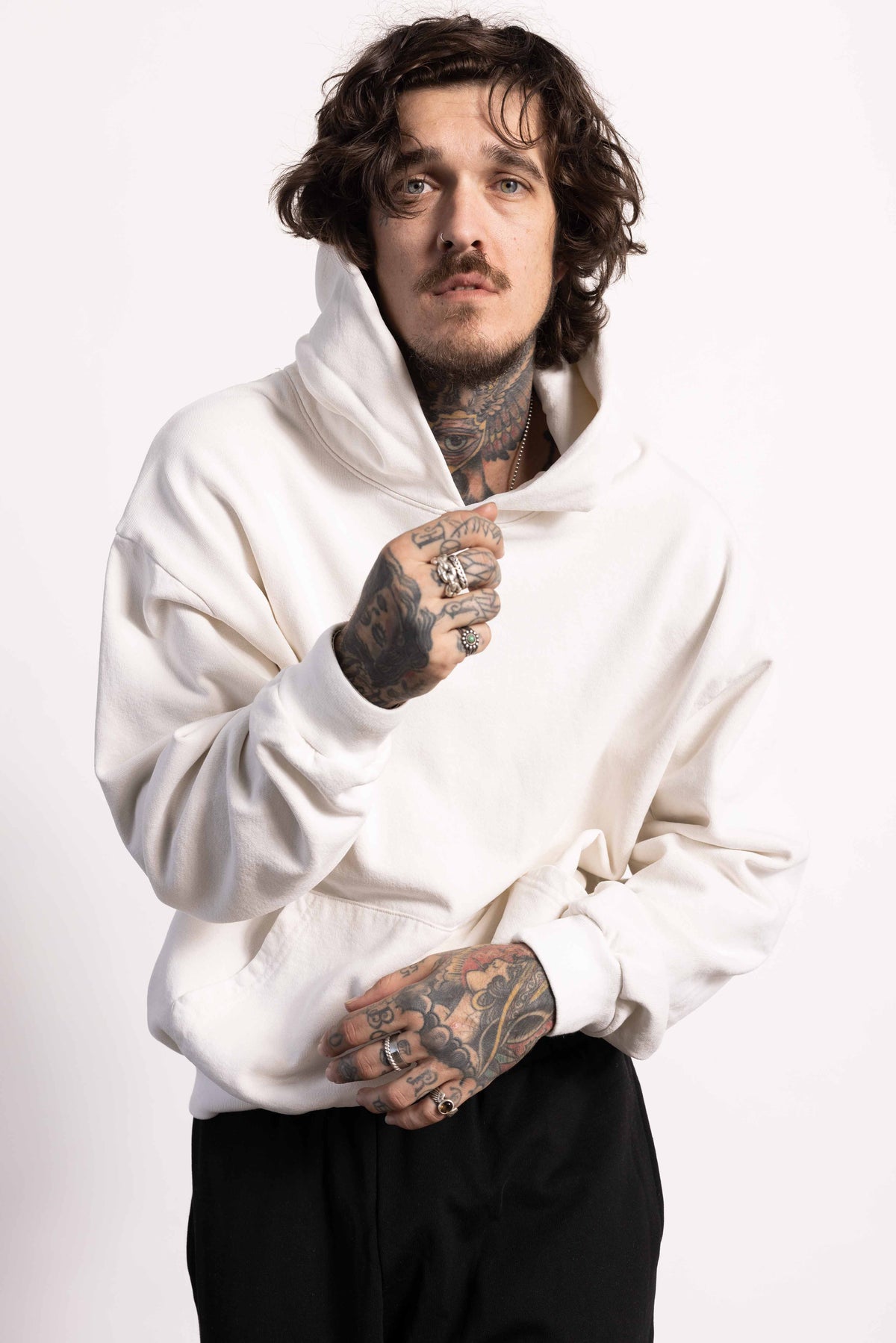White male model with edgy style wearing a heavyweight cotton off white hoodie